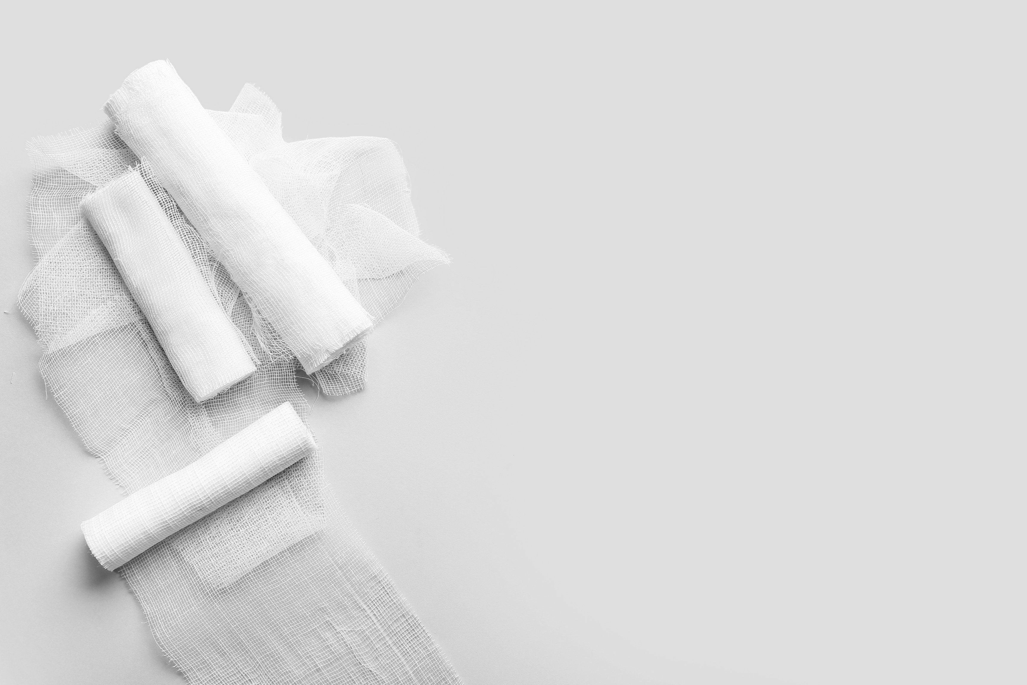 Medical Gauze Rolls on Light Background